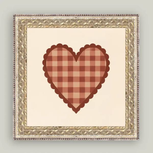 Framed plaid heart artwork on a cream background