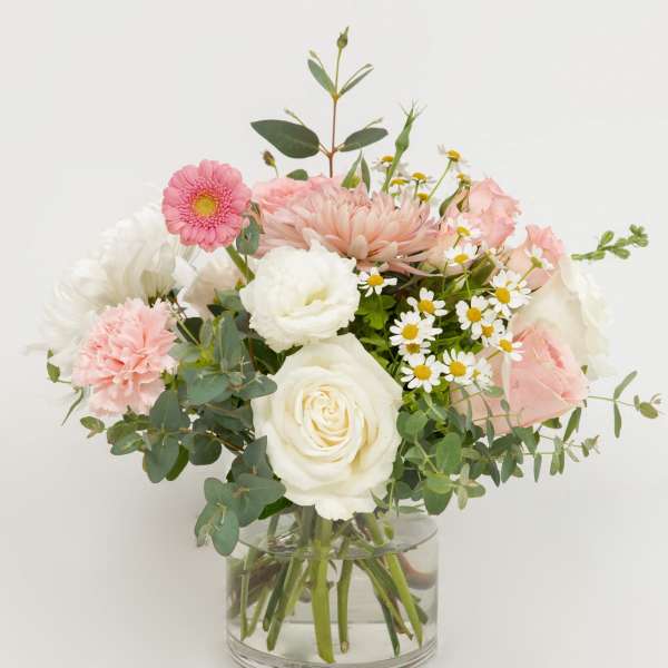 Pink and white mixed bouquet in a clear glass vase