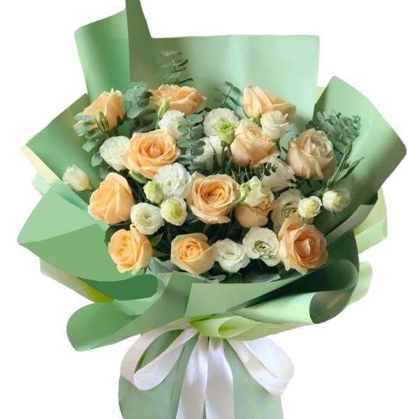 Peach and white rose bouquet wrapped in mint green paper with a white ribbon