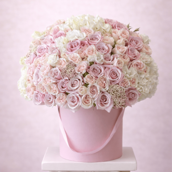 Pink and white rose bouquet in a pink hatbox