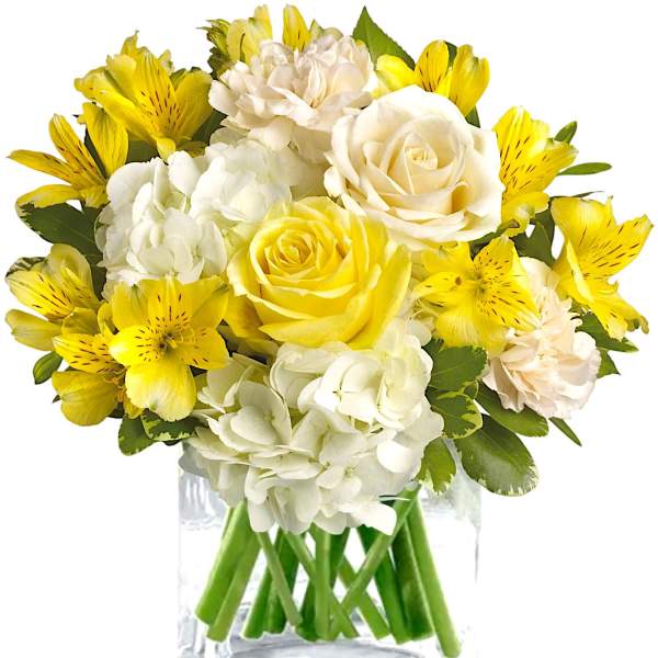 Yellow and white bouquet in a clear glass vase