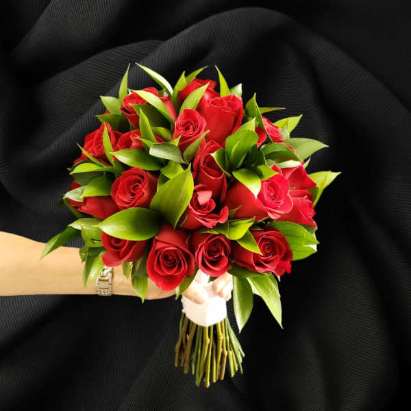 Bouquet of red roses with green foliage