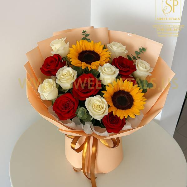 Bouquet of red and white roses with two sunflowers in peach wrapping