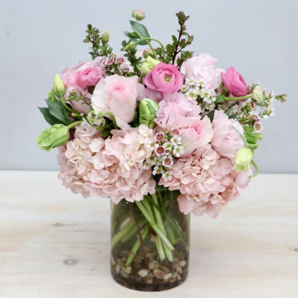 Pink and white bouquet in a glass vase
