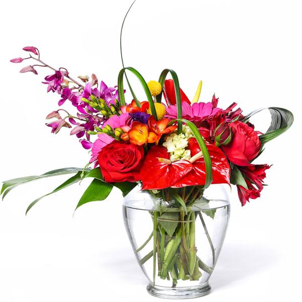 Colorful mixed bouquet in a clear glass vase