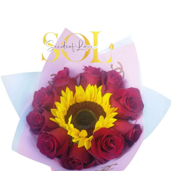 Bouquet of red roses with a yellow sunflower in pastel wrapping