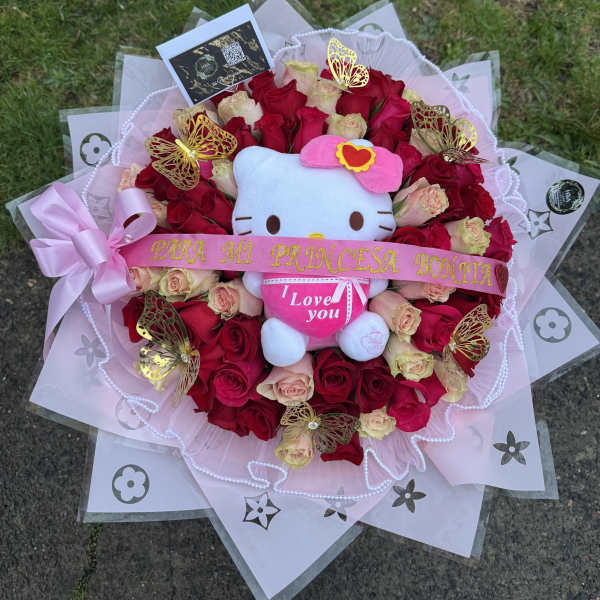 Bouquet of red and blush roses with a Hello Kitty plush and pink ribbon