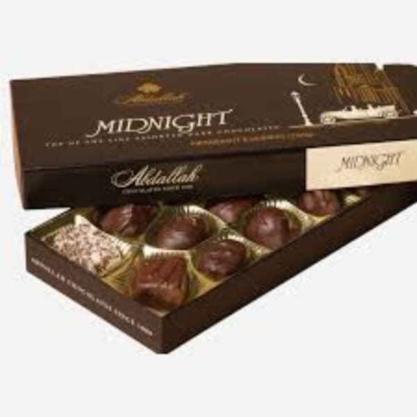 Boxed chocolates in a brown gift box with the lid partly open