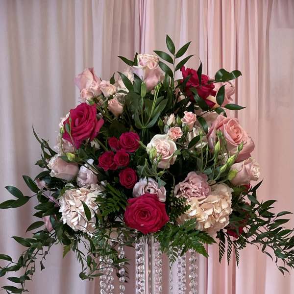 Pinks on tall glass vase