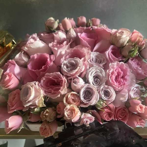 Bouquet of pink and lavender roses with a few pale buds