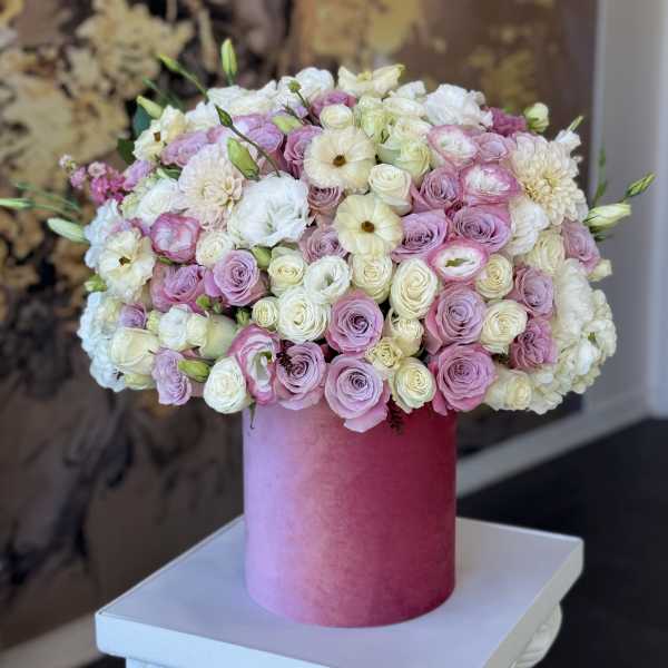 Pink and white rose bouquet in a tall pink box