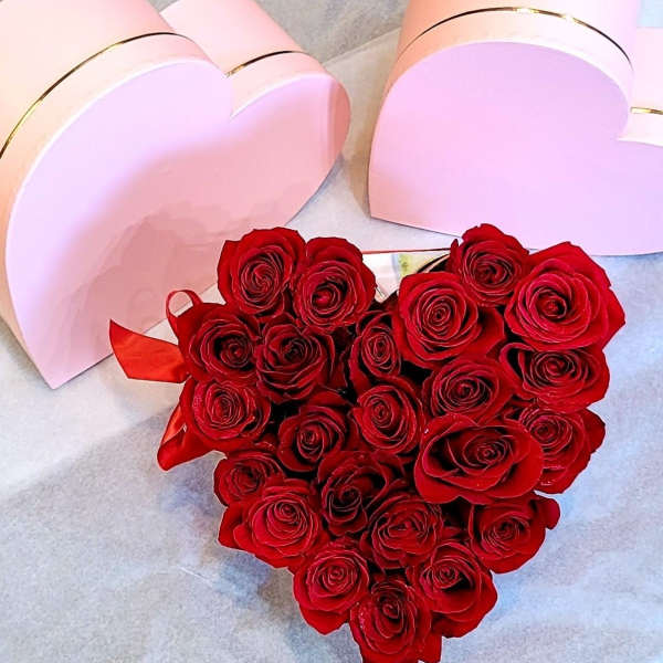 Heart-shaped box filled with red roses