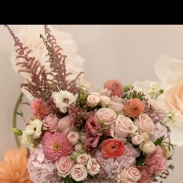 Pink and white mixed flower arrangement in a white vase