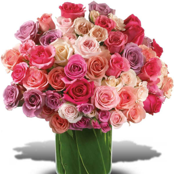 Bouquet of pink and lavender roses in a clear glass vase