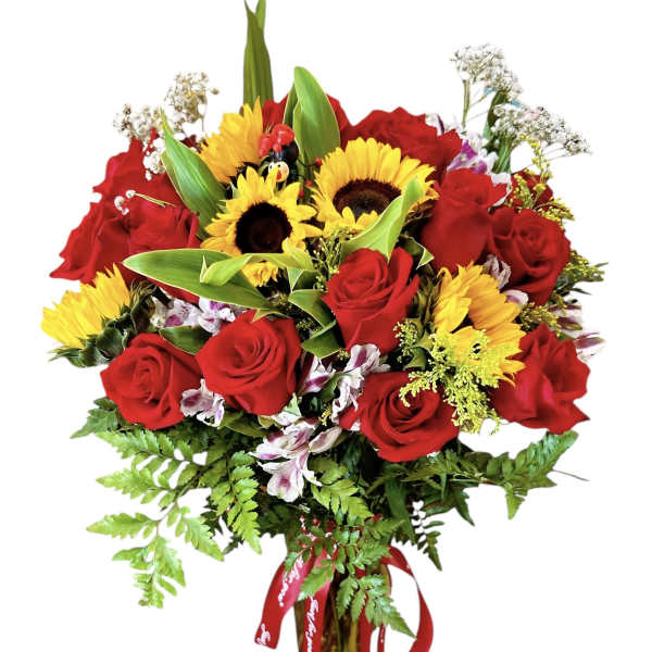 Bouquet of red roses and yellow sunflowers in a glass vase