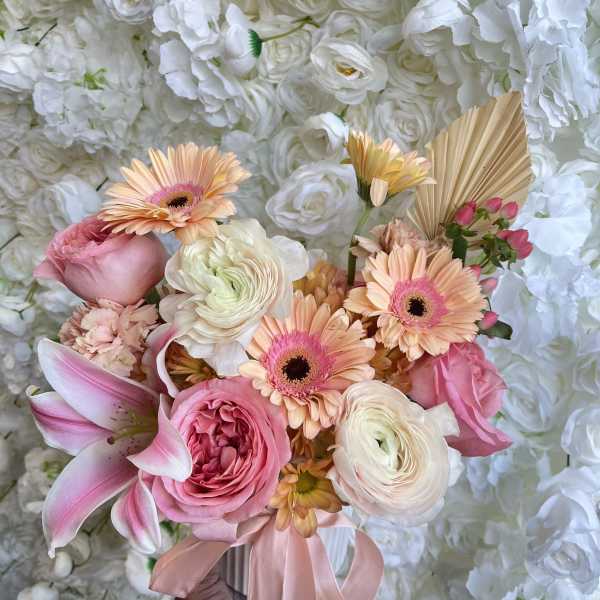 Pink and peach bouquet with lilies, roses, and gerbera daisies