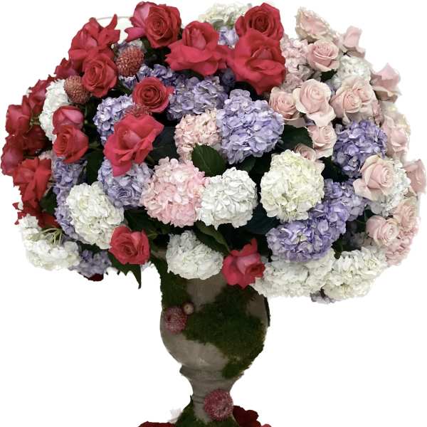 Large bouquet of roses and hydrangeas in a pedestal vase