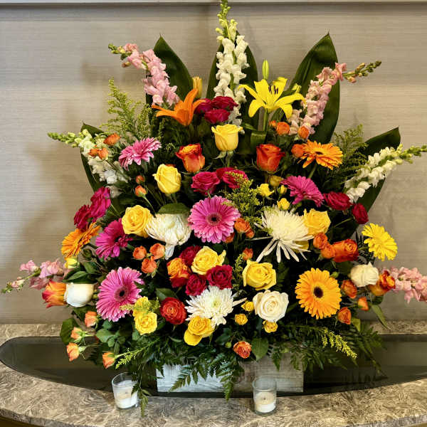 Large mixed bouquet with roses, gerbera daisies, lilies, and snapdragons