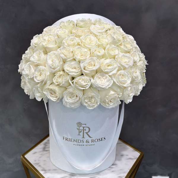 White rose bouquet in a round white hat box