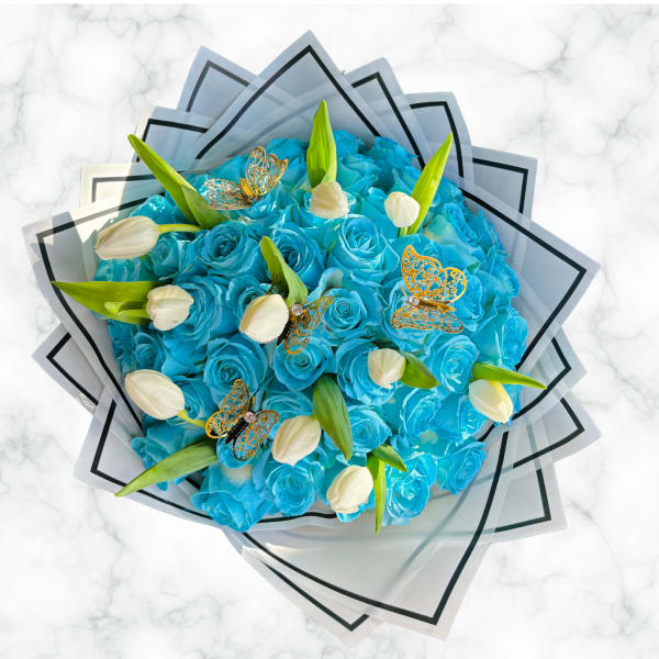 Blue rose bouquet with white tulips and butterfly accents