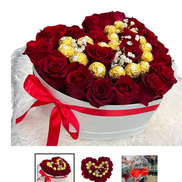 Heart-shaped box of red roses with gold-wrapped chocolates and baby's breath