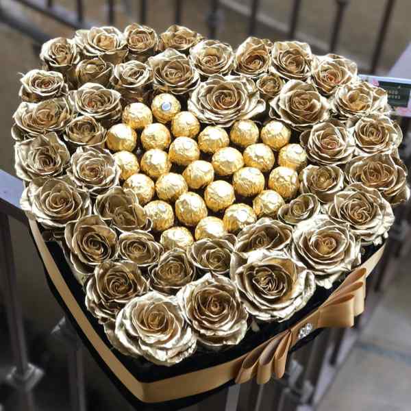 Heart-shaped box of gold roses with Ferrero Rocher chocolates in the center