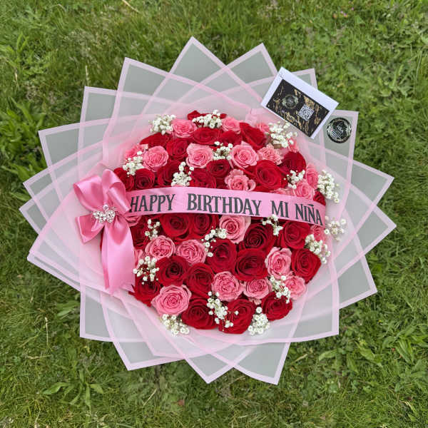 Pink and red rose bouquet with a birthday ribbon and bow