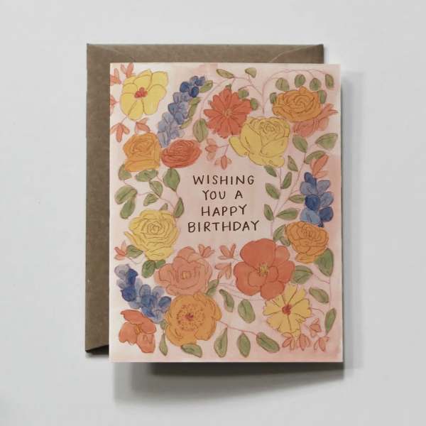Birthday card with watercolor flowers and a brown envelope