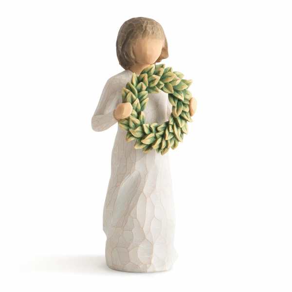 Figurine holding a green leaf wreath