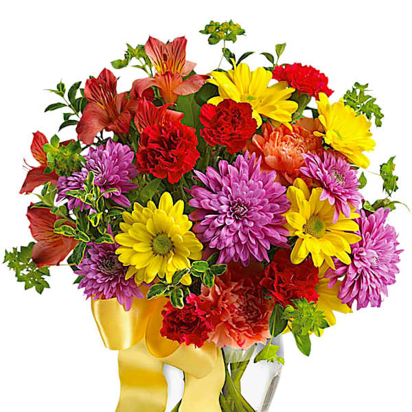 Colorful mixed bouquet in a clear glass vase with a yellow ribbon