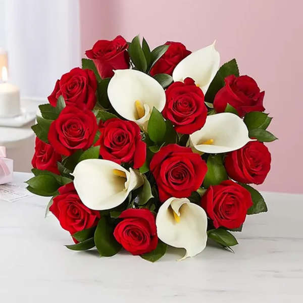 Bouquet of red roses and white calla lilies