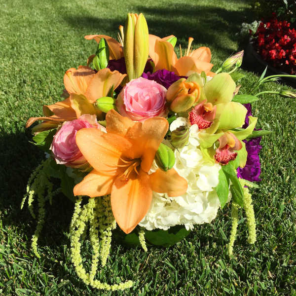 Bouquet of orange lilies, pink roses, and white hydrangea