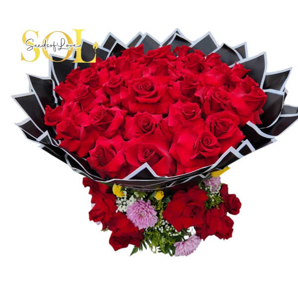 Large bouquet of red roses with small pink flowers