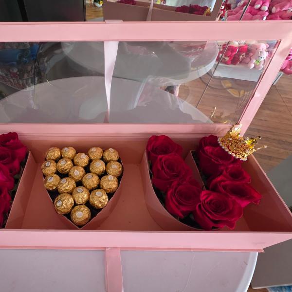 Pink gift box with red roses and Ferrero Rocher chocolates