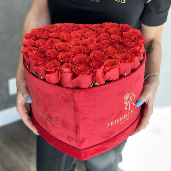 Heart-shaped box filled with red roses