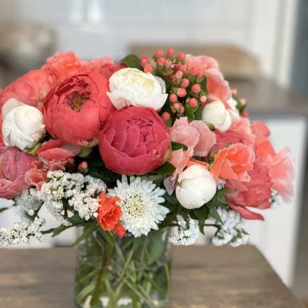 Pink and white mixed bouquet in a clear glass vase