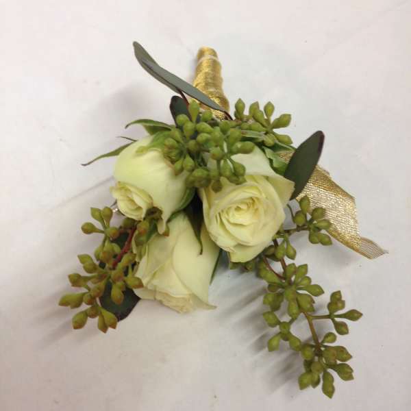 Small white rose boutonniere with green foliage and gold ribbon