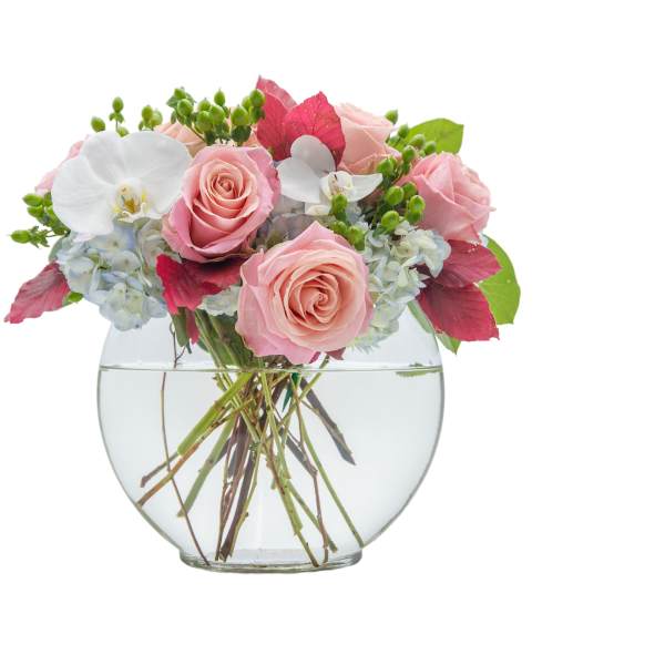 Pink roses and white orchids in a clear glass vase
