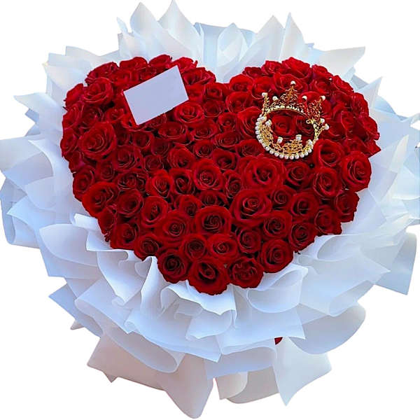 Heart-shaped bouquet of red roses wrapped in white paper