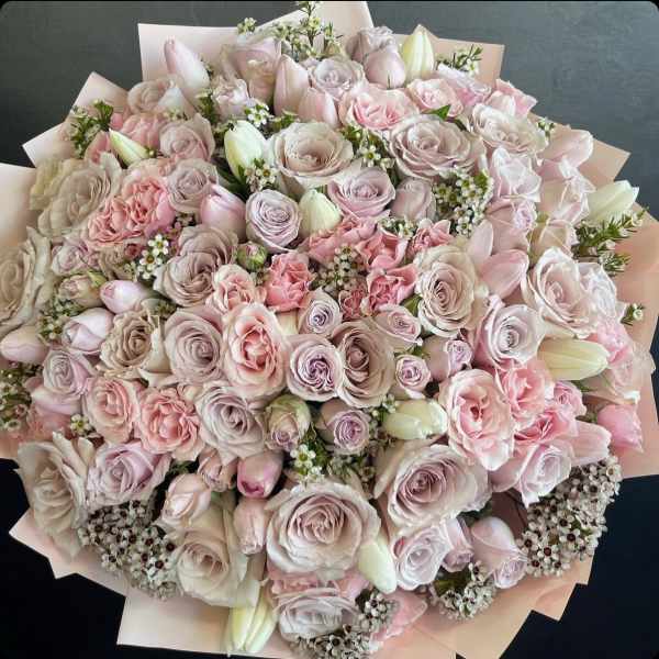 Large bouquet of pale pink and cream roses with white buds