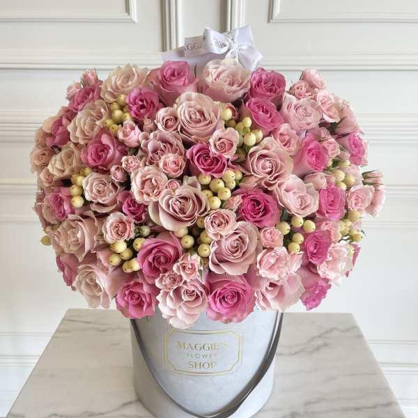 Large pink rose bouquet in a round hat box