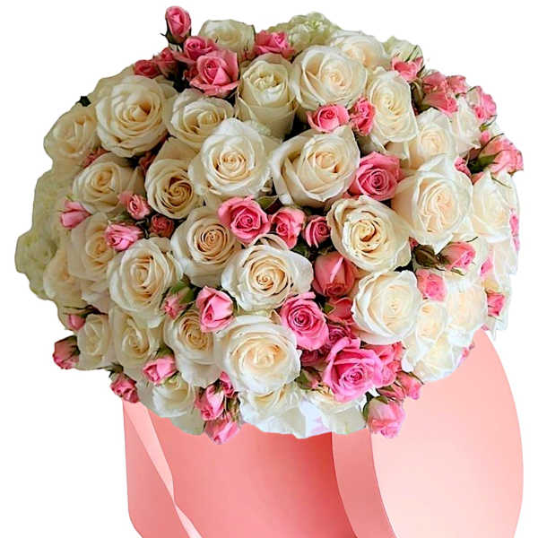 Bouquet of white and pink roses in a pink hatbox