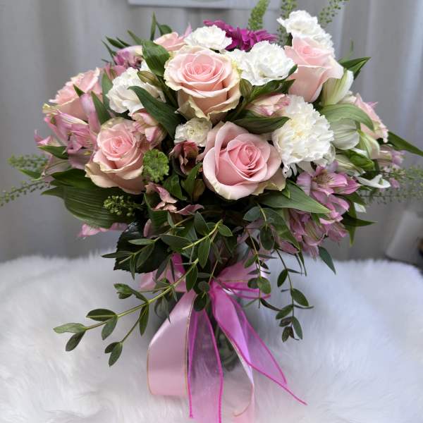 Pink and white rose bouquet with ribbon