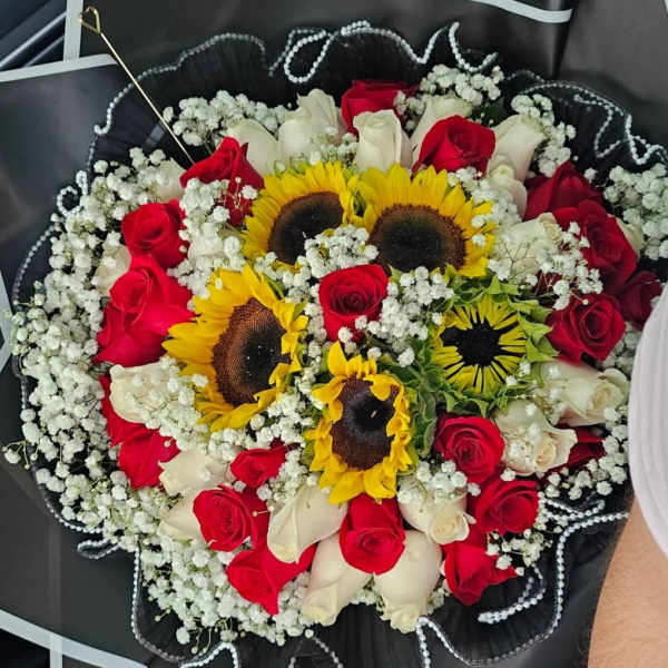 Bouquet of red and white roses with sunflowers and baby's breath