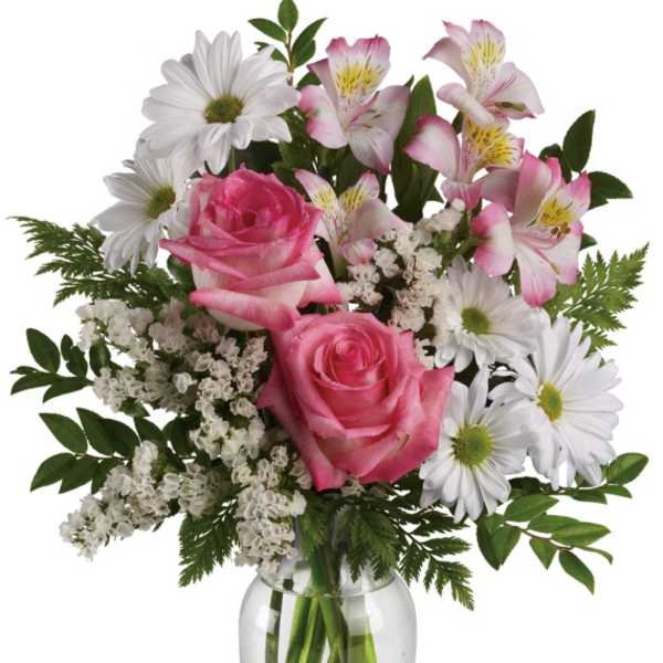 Pink roses and white daisies with alstroemeria in a glass vase