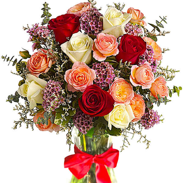 Bouquet of red, white, and peach roses in a glass vase with a red ribbon