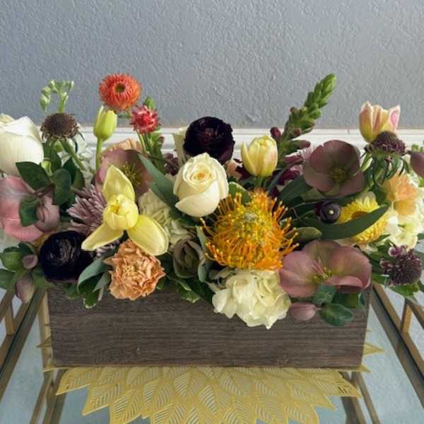 Mixed floral arrangement in a rectangular wooden box