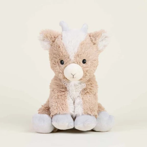 Plush stuffed animal with tan and white fur sitting against a plain background