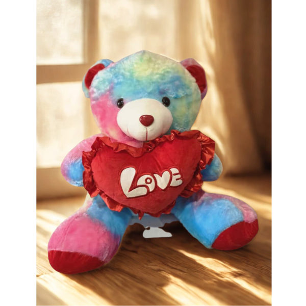 Colorful teddy bear holding a red heart with the word Love