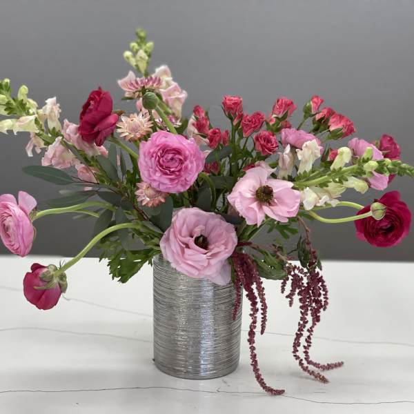 Pink and red mixed bouquet in a silver vase